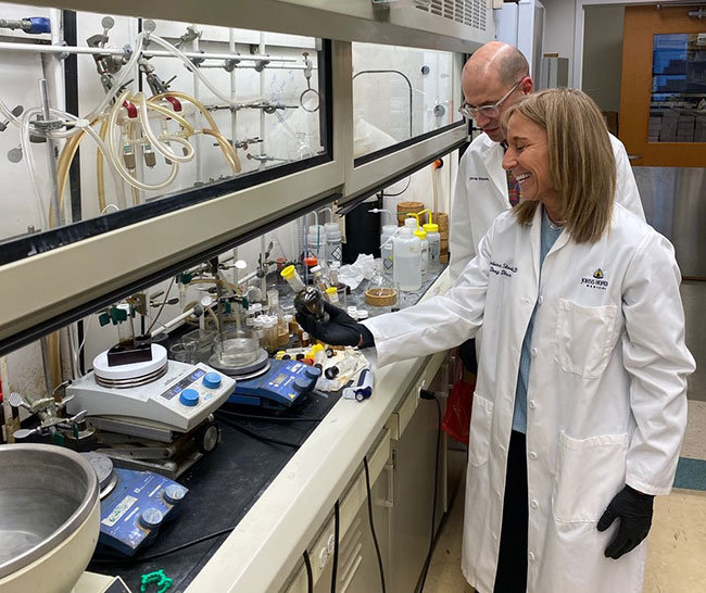 Matt Stremlau and Barbara Slusher in their lab
