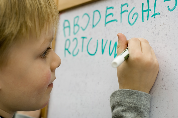 Image of child writing