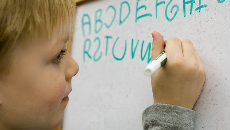 Image of child writing