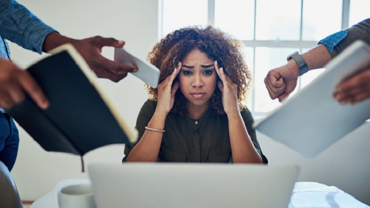 Image of a stressed out woman at work