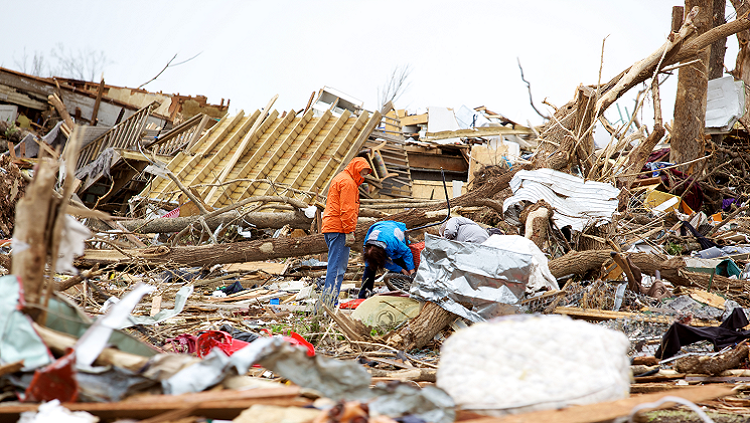 Image of people looking for personal items only a few days following a storm