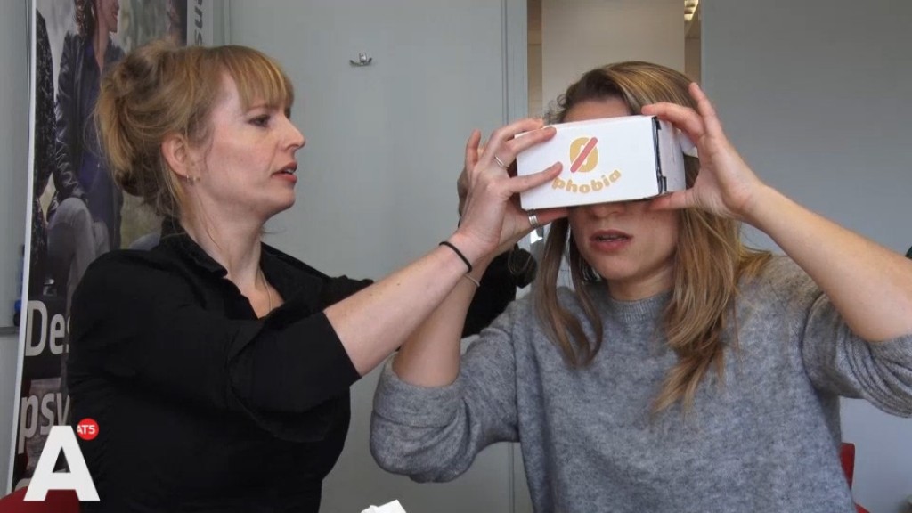 Woman looking through virtual reality goggles