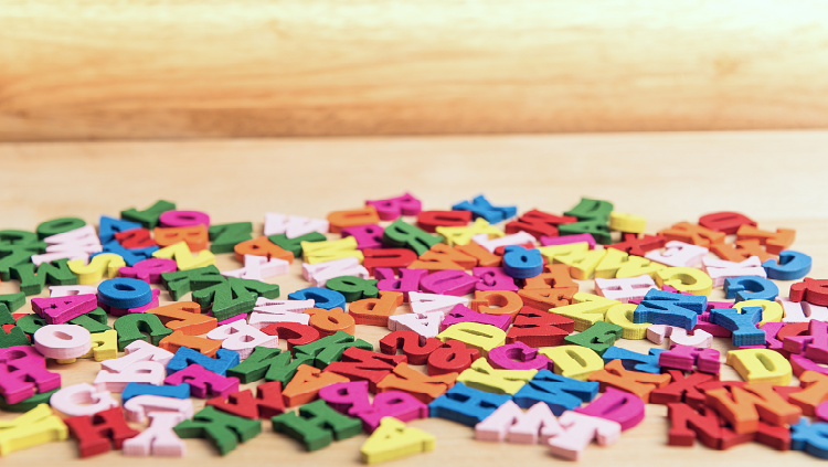 Photograph of multicolored letters on a table