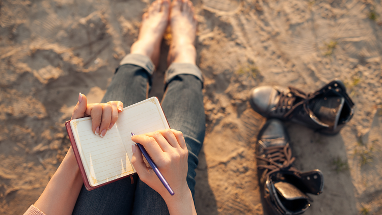 Woman writing in a journal