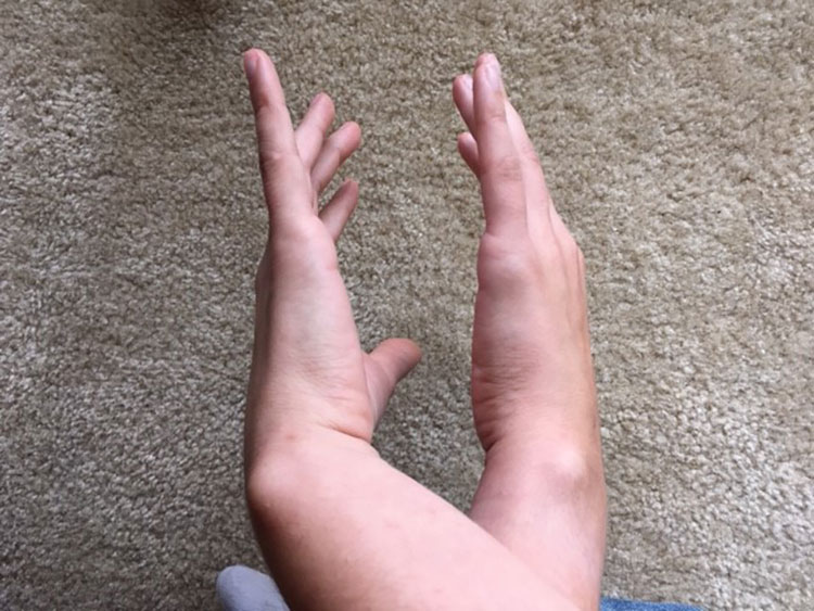 Hands crossed facing each other