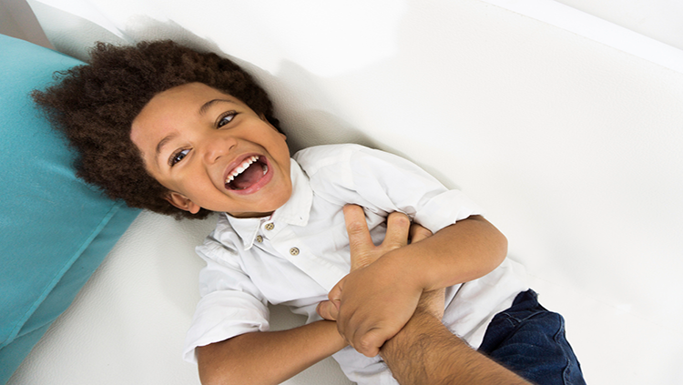 Boy being tickled