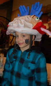 boy wearing brain hat