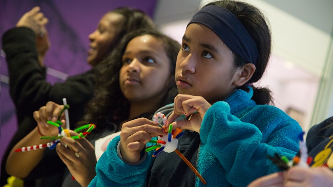 Students create neurons at a Brain Awareness Week event. 