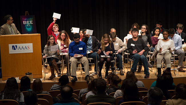 Students on stage during the Washington, DC Brain Bee held at AAAS on February 10, 2015. The regional Washington, DC Brain Bee shown above, move on to national competitions in 23 countries, and those winners move on to compete in the International Brain Bee