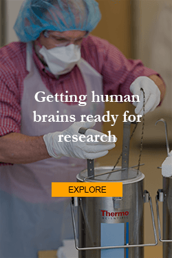 Researcher working with liquid nitrogen canister