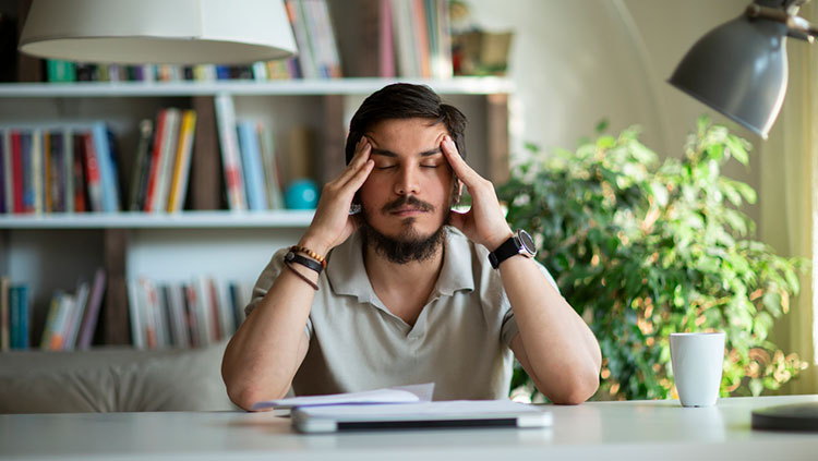 Man with hands on head