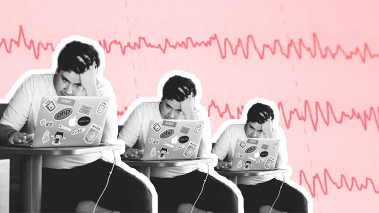 man staring in frustration at laptop