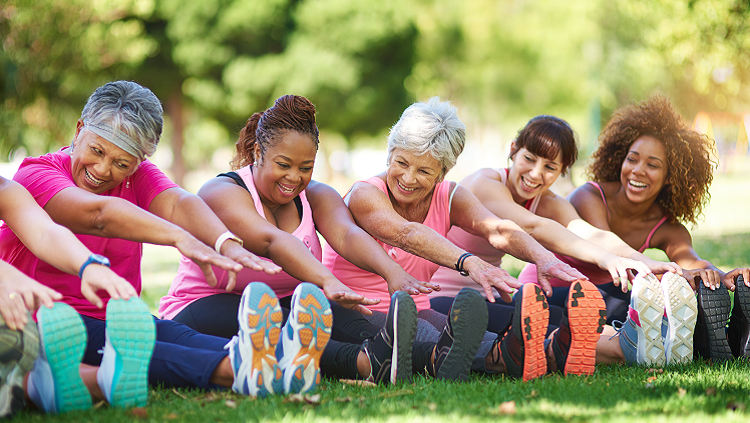 Image of elderly women stretching in the park