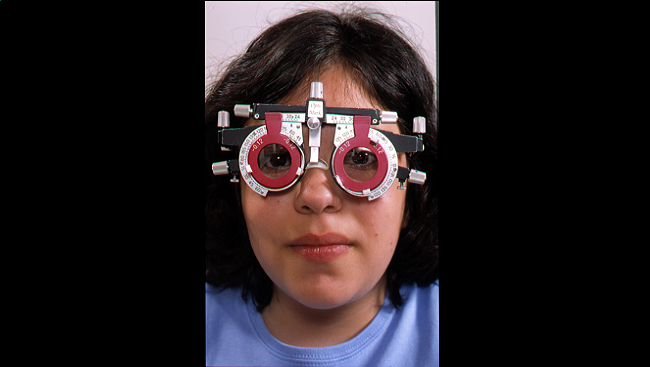 Child being tested for visual disorders