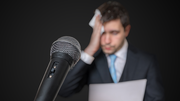 Image of a man scared of speaking in front of crowd