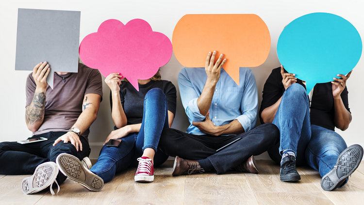 people holding speech clouds