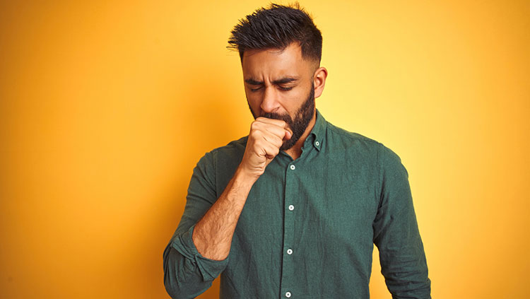 Man covering his mouth with hand