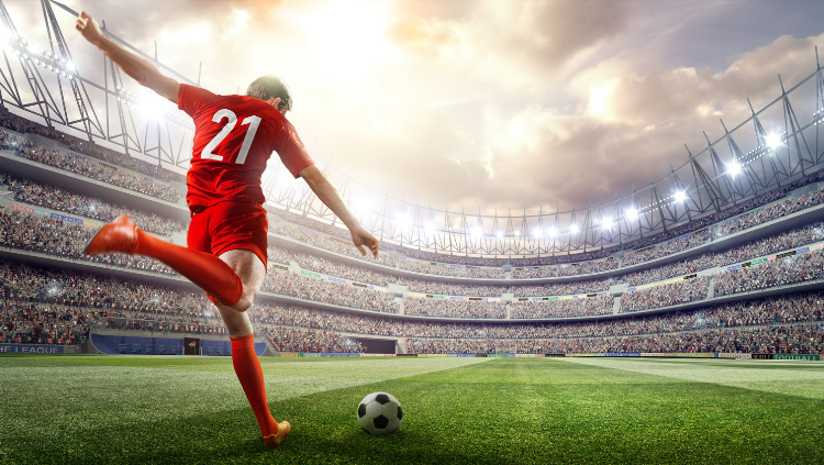 Man kicking soccer ball