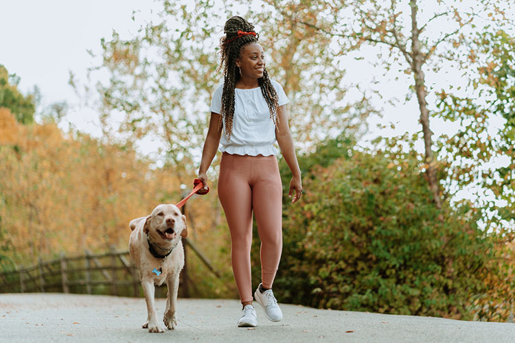 Woman walking dog