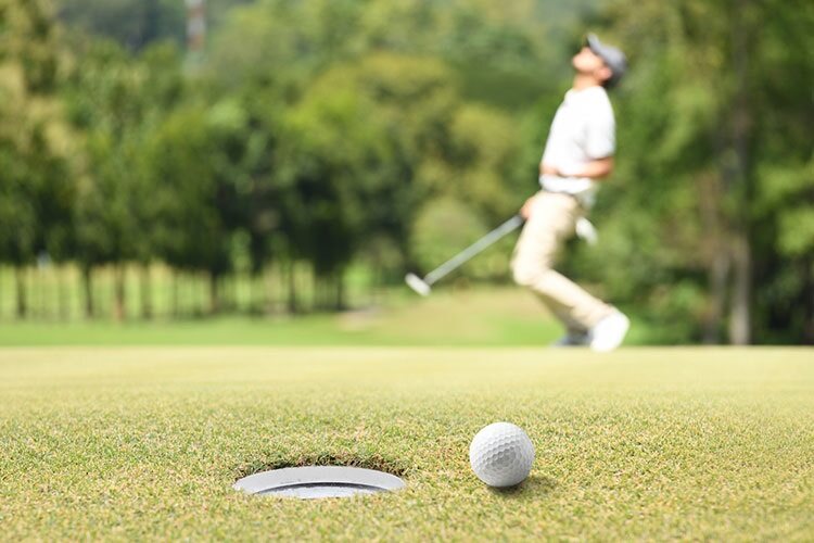Golf ball misses hole
