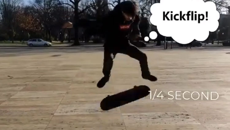 Young boy doing a kick flip on a skateboard