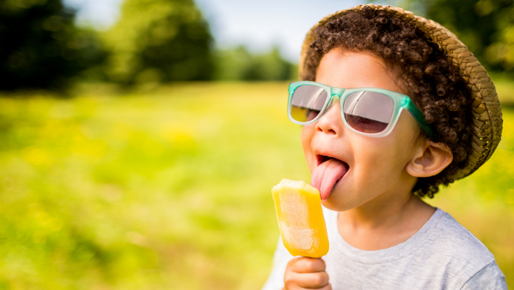 photograph of child with a popsicle