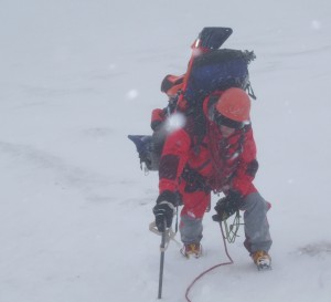 Hiker resting in winter surroundings