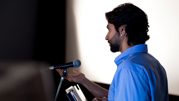 Man speaking into microphone