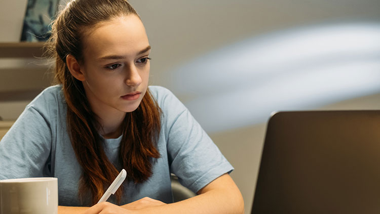 Girl studying at computer