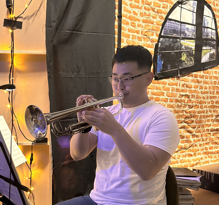 Sang Hyun Kim playing trumpet