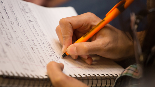 A close up of an attendee's notebook while taking notes at a workshop during Neuroscience 2017